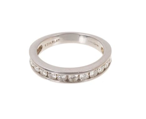 Diamond eternity ring with a half hoop of twelve brilliant cut diamonds in platinum channel setting. Estimated total diamond 