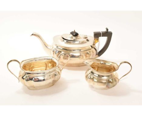 1920s silver three piece tea set, comprising teapot of compressed baluster form, hinged domed cover and angular ebony handle,
