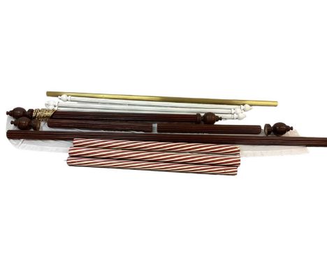 Two mahogany curtain poles with finials and gold metal curtain rings, four brass brackets, long together with three smaller p