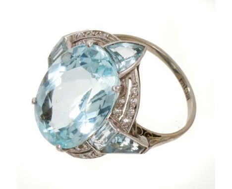 Art deco aquamarine and diamond ring with a large oval mixed cut aquamarine measuring approximately 18.4 x 12.7 x 8mm, surrou