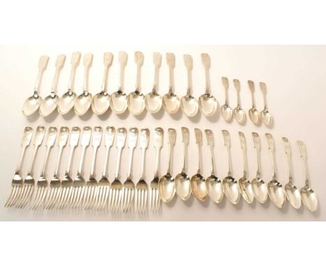 Large group of matching late Victorian and early Edwardian, silver Fiddle and Shell pattern flatware, comprising eleven table