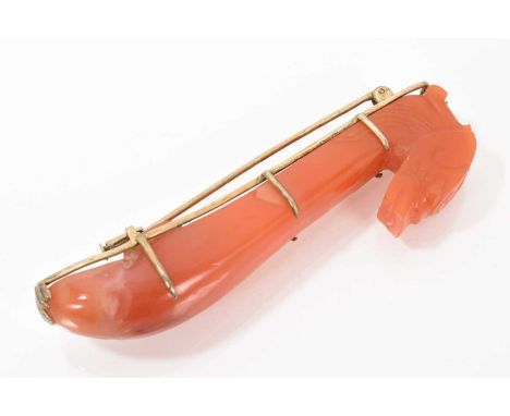 Chinese jade or red hardstone brooch in the form of a sceptre with dragons head terminal in a silver brooch mount, 80mm.Good 