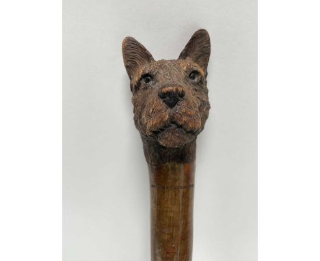 Swaine &amp; Adeney stick with a carved terrier head knop, stamped to shaft, 94cm long, together with another antique cane, t