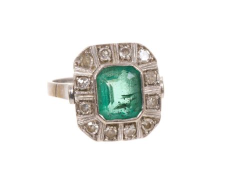 Art Deco style emerald and diamond cluster ring with a rectangular step cut emerald measuring approximately 8.3 x 7 x 4.5mm, 