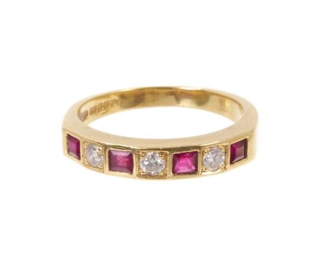 Diamond and ruby 18ct gold eternity ring with a half hoop of three brilliant cut diamonds and four step cut rubies, hallmarke