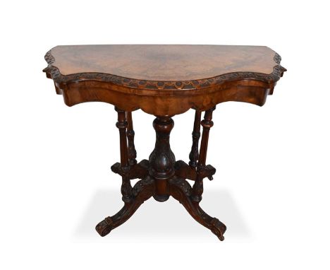 Victorian walnut card table, with serpentine figured fold over top raised on solid legs and splayed supports on castors, 100c