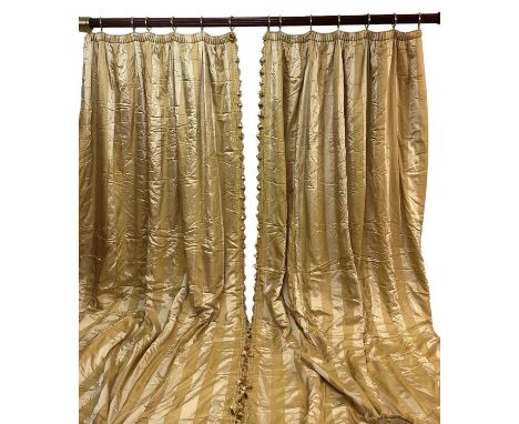 One very large pair of Pierre Frey Etad silk and acetate gold striped curtains with tasselled fringe and rope braid decoratio