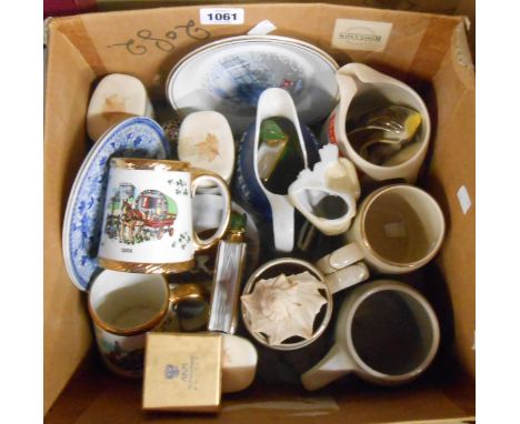 A box containing a quantity of ceramic items including pub advertising jugs, etc.