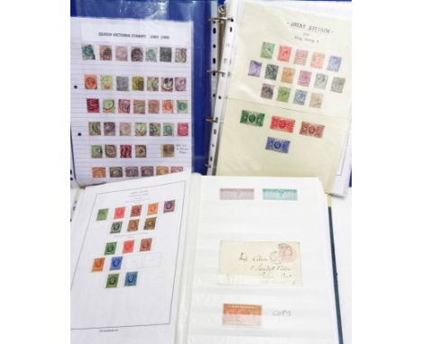 A green stock album containing a collection of Victorian and later GB stamps, mint and used, including numerous commemorative