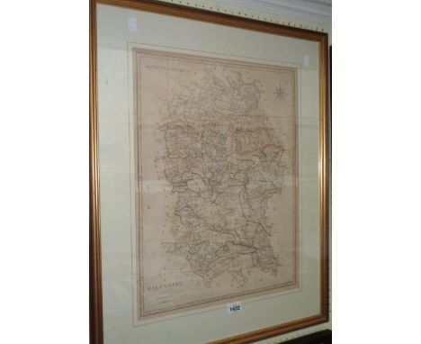 A framed antique map print of Wiltshire with hand painted line borders