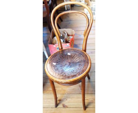 An antique Czechoslovakian bentwood standard chair with machine pressed decoration to seat panel