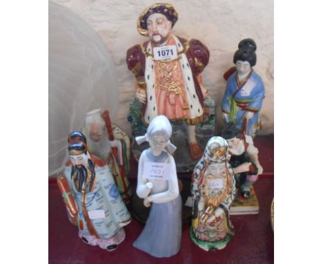 A quantity of ceramic figurines, including Victorian Staffordshire cobbler, large Henry VIII, etc.