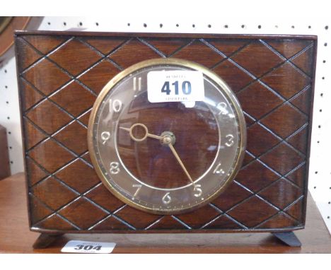 A retro stained wood cased desk timepiece