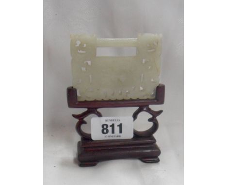 A vintage Chinese carved jade miniature screen, in carved hardwood stand