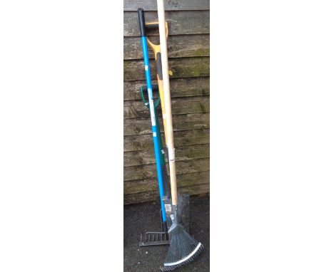A quantity of garden tools including post digger, etc.