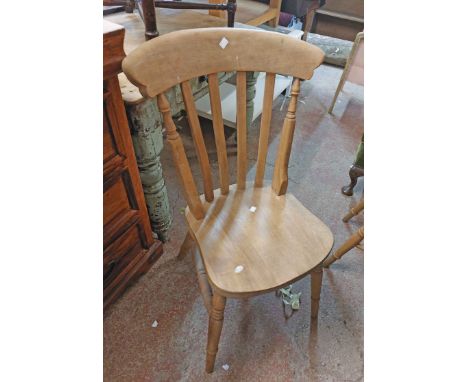 A 20th Century oak Windsor style kitchen chair with moulded sectional seat, set on ring turned legs