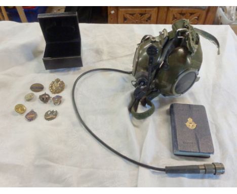 A vintage aircraft headphone set, a WWII period RAF service edition bible and a box containing a quantity of enamel and other