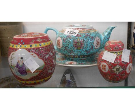 A 20th Century Chinese porcelain teapot with famille rose enamel decoration on turquoise ground and a similar plate - sold wi