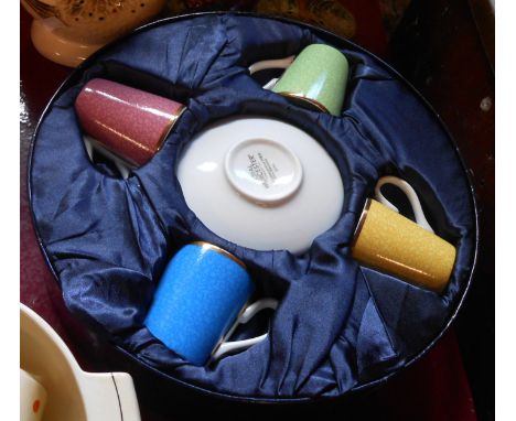 A boxed Royal Worcester four place coffee set made to celebrate the Queens 80th birthday