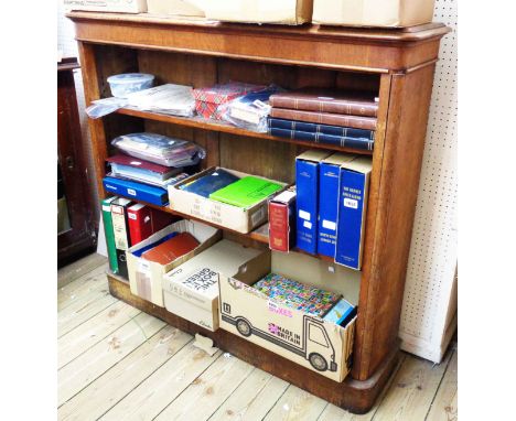 A 1.22m old oak three shelf open bookcase with rounded ends and plinth base