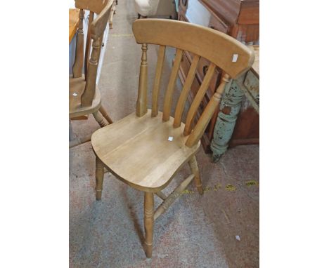 A 20th Windsor style kitchen chair with solid sectional seat, set on ring turned supports