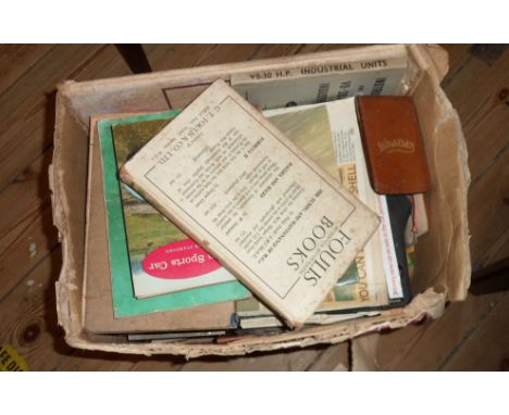 A box containing a quantity of motoring books including 1910 Motor Manual, RAC and AA guide and handbooks, maps, etc.