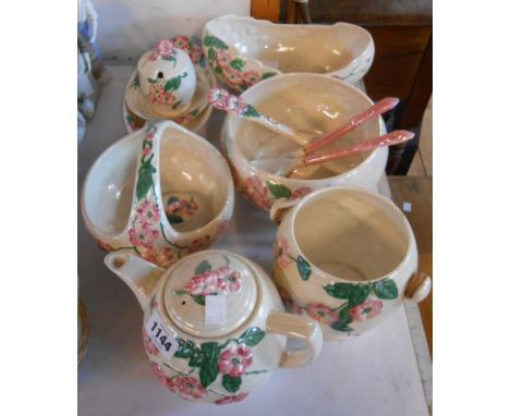 A quantity of Maling pottery lustreware with moulded floral decoration on a pearline ground including bowls, teapot, preserve