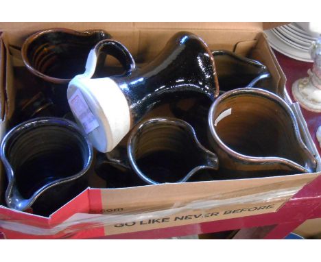 A small box containing a quantity of Jeremy Leach studio pottery jugs