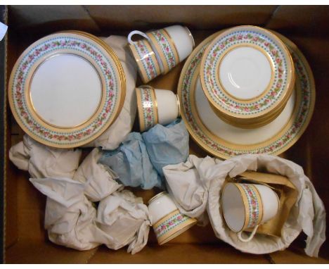 A box containing a late 19th Century Royal Worcester bone china tea set with hand painted rose decoration