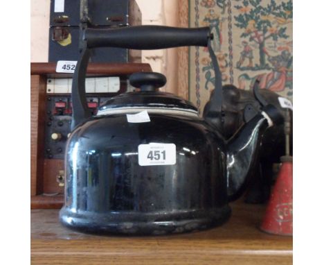 A Le Creuset black enamel kettle