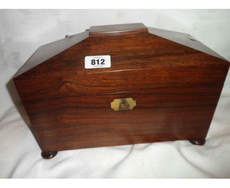 A Victorian rosewood tea caddy of sarcophagus form, with two interior lift top canisters within fitted interior - mixing bowl