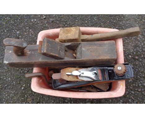 A crate containing assorted tools including plane, etc.