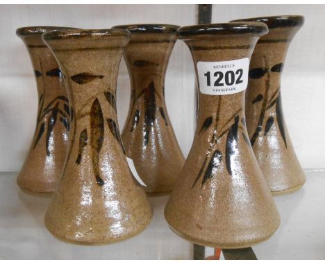 Five Jeremy Leach Studio Pottery vases of waisted cylindrical form with painted leaf decoration