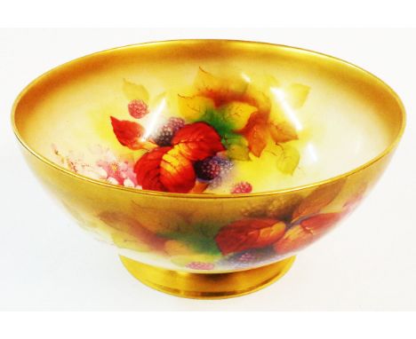 A Royal Worcester porcelain footed bowl hand painted to both the interior and exterior with bramble and gilt highlighting - s