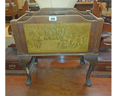 An old stained mixed wood freestanding magazine rack with remains of applied print decoration, set on cabriole legs with pad 