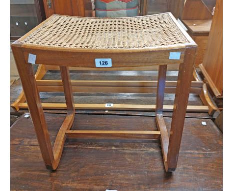 A vintage stained mahogany framed dressing stool with rattan seat panel