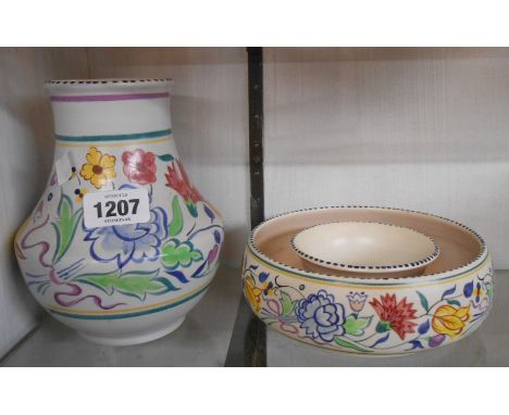 A vintage Poole Pottery vase decorated with a central floral frieze - sold with a similar round posy vase