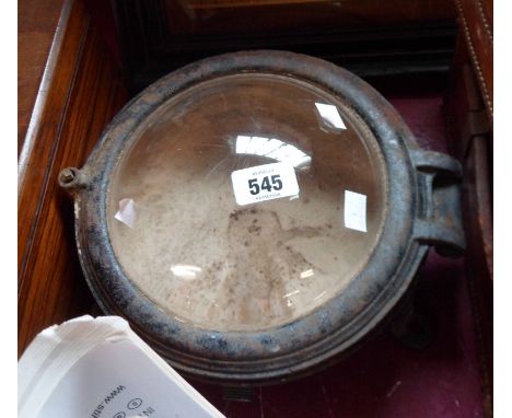 A vintage cast iron interior bulkhead lamp with convex glass window