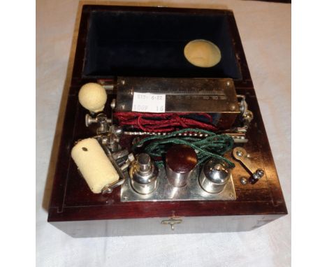 A vintage Every Ready medical coil EST machine with hand grips, metal pads and roller, etc. in fitted mahogany box (9volt)