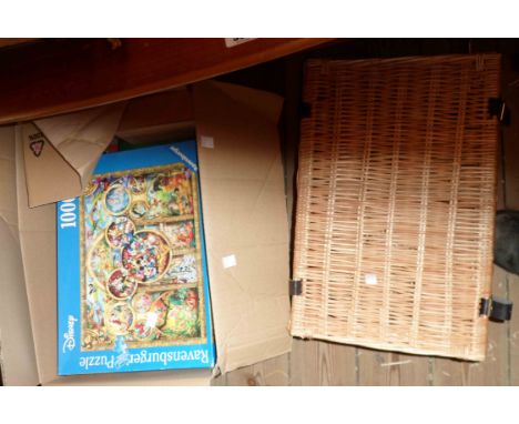 A box containing a quantity of assorted games - sold with a wicker hamper