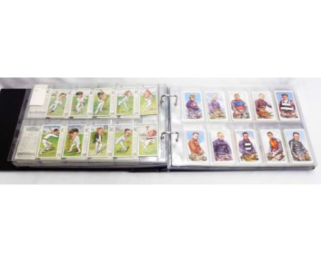 A green ring bound album containing a large collection of sleeve mounted sets and part sets of cigarette cards including Play