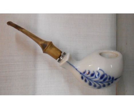 A Royal Copenhagen porcelain smoker's pipe, the bowl decorated with transfer printed blue flowers, with silver plated collar 