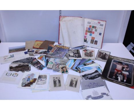 A selection of vintage ephemera including postcards and stamps etc 