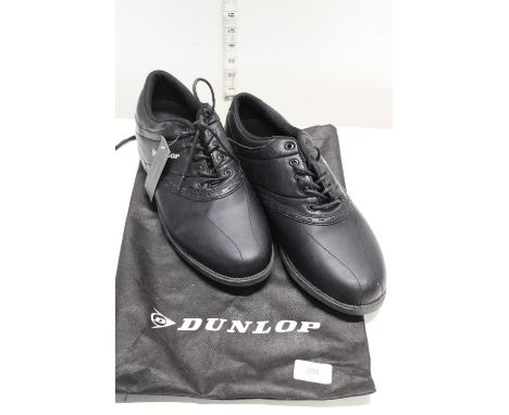 A new pair of Dunlop golf shoes size 11 