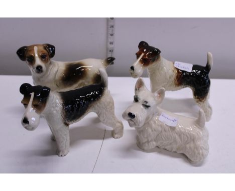 Four Cooper craft ceramic dog figures 