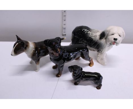 Four Cooper craft ceramic dog figures 