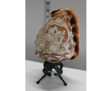 A antique carved shell lamp 