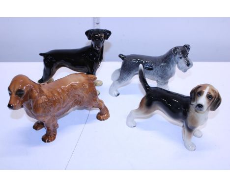 Four Cooper craft ceramic dog figures 
