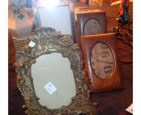 Collection of photo frames to include vintage heavy brass frame in Art Nouveau style with swags and ribbons and putti 