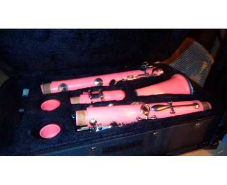 Cased pink four piece clarinet 
